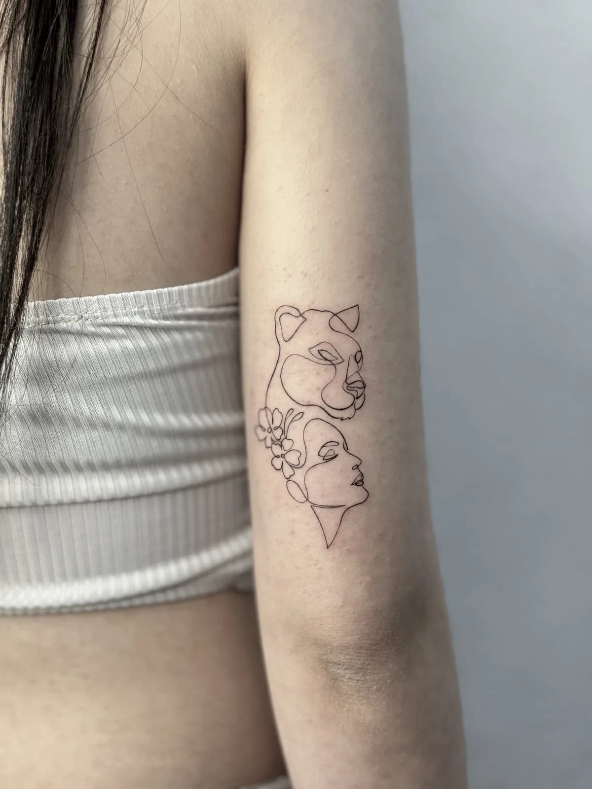 Fine Line — Lioness and woman, one line