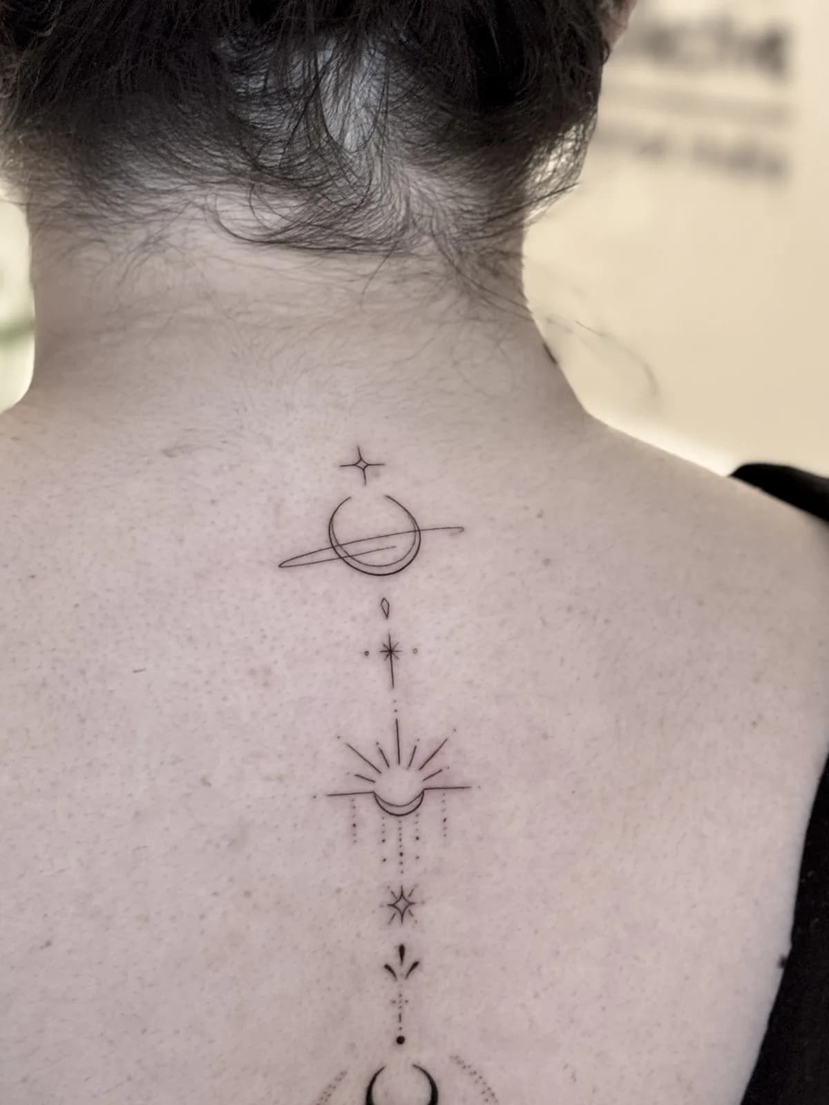 Ornamental — Saturn and sun, spine